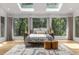 Sun-filled bedroom with forest views and a neutral color palette at 570 Matterhorn Way, Alpharetta, GA 30022