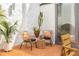 Exterior patio seating area featuring terracotta tile, potted plants, and greenery at 570 Matterhorn Way, Alpharetta, GA 30022