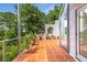 Charming patio features terracotta tile, potted plants, greenery and outdoor access at 570 Matterhorn Way, Alpharetta, GA 30022
