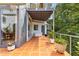 Exterior patio featuring terracotta tile, glass enclosure and greenery at 570 Matterhorn Way, Alpharetta, GA 30022