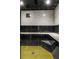Walk-in shower with modern tile, bench, and black accents, offering a spa-like experience at home at 570 Matterhorn Way, Alpharetta, GA 30022