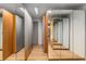 Spacious walk-in closet with custom shelving, mirrored doors, and hardwood flooring for optimal storage at 570 Matterhorn Way, Alpharetta, GA 30022