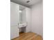 Modern white walk-in closet with vanity, drawer, and ample storage at 570 Matterhorn Way, Alpharetta, GA 30022