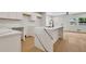 Bright kitchen features white cabinets and an island with marble countertops at 1733 Hollyhock Ter, Decatur, GA 30032
