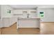 Kitchen featuring white cabinets and island with marble countertops at 1733 Hollyhock Ter, Decatur, GA 30032