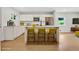 Modern kitchen boasts sleek white cabinetry, stainless steel appliances, and island seating at 1733 Hollyhock Ter, Decatur, GA 30032