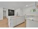 Bright kitchen features white cabinets, marble countertops, and black hardware at 1733 Hollyhock Ter, Decatur, GA 30032