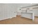 Kitchen featuring white cabinets and a large island with black hardware at 1733 Hollyhock Ter, Decatur, GA 30032