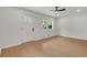 Bright, open living area with hardwood floors, windows, a ceiling fan, and a freshly painted white walls at 1733 Hollyhock Ter, Decatur, GA 30032