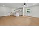 Bright living space with hardwood floors, white kitchen island, white walls and a ceiling fan at 1733 Hollyhock Ter, Decatur, GA 30032