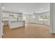 Open-concept living space with hardwood floors, white walls, kitchen island and plenty of natural light at 1733 Hollyhock Ter, Decatur, GA 30032