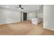 Bright living space with hardwood floors, white kitchen island, white walls and a ceiling fan at 1733 Hollyhock Ter, Decatur, GA 30032