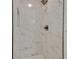 Modern shower with marble tile and bronze fixtures adds luxury to the bathroom at 1733 Hollyhock Ter, Decatur, GA 30032