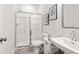 Contemporary bathroom featuring a glass-enclosed shower, vanity, and modern fixtures at 206 Maycrest Path, Tucker, GA 30084