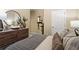 Cozy bedroom with a large mirror, plants and neutral tones at 206 Maycrest Path, Tucker, GA 30084