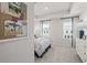 Bright bedroom with tray ceiling, large windows, and floral bedding at 206 Maycrest Path, Tucker, GA 30084