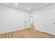 Finished basement with wood-look flooring, recessed lighting, white walls and a paneled door at 383 Oakridge Dr, Cartersville, GA 30121