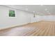 Large finished basement with recessed lighting, wood-look floors, and white walls with a small window at 383 Oakridge Dr, Cartersville, GA 30121