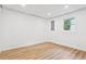 Basement with wood-look flooring and a window for natural light at 383 Oakridge Dr, Cartersville, GA 30121