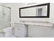 Bathroom featuring a granite vanity top, white cabinets, and a glass shower enclosure at 383 Oakridge Dr, Cartersville, GA 30121