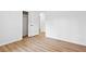 Bedroom with wood-look floors, white walls, and access to a closet at 383 Oakridge Dr, Cartersville, GA 30121
