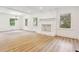 Spacious living room with hardwood floors, stone fireplace, neutral paint, and ample natural light at 383 Oakridge Dr, Cartersville, GA 30121