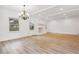 Bright living room with hardwood floors, stone fireplace, neutral paint, and ample natural light at 383 Oakridge Dr, Cartersville, GA 30121