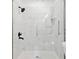 Elegant shower featuring marble tile and sleek black fixtures at 383 Oakridge Dr, Cartersville, GA 30121