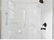 Modern shower with marble-style tiling and black hardware at 383 Oakridge Dr, Cartersville, GA 30121