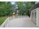 A spacious back deck offers space for outdoor entertaining, with a playset and private backyard at 525 Old Path Xing, Roswell, GA 30075