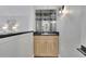 Upstairs bar area with cabinet storage, sink, and decorative lighting at 525 Old Path Xing, Roswell, GA 30075