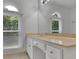 Elegant bathroom with framed windows, white cabinets, and stylish gold hardware at 525 Old Path Xing, Roswell, GA 30075