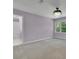 Bright bedroom featuring plush carpet, chandelier lighting, and a large window at 525 Old Path Xing, Roswell, GA 30075