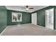 Spacious bedroom boasts neutral carpet and a large window offering natural light at 525 Old Path Xing, Roswell, GA 30075