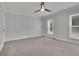 Neutral bedroom with carpet and two windows providing natural light at 525 Old Path Xing, Roswell, GA 30075