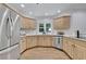 Well-equipped kitchen featuring light wood cabinets, stainless steel appliances, and lots of natural light at 525 Old Path Xing, Roswell, GA 30075