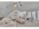Spacious living room with plush carpet, comfortable seating, staircase, and view into the kitchen at 525 Old Path Xing, Roswell, GA 30075