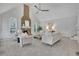 Living room features a stone fireplace, high ceilings, neutral paint, and plush carpet at 525 Old Path Xing, Roswell, GA 30075