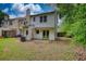View of the home's backyard featuring a patio and partial fence at 1696 Hunting Creek Dr Se, Conyers, GA 30013