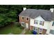 View of the home's exterior featuring brick and vinyl siding, landscaping and a sidewalk at 1696 Hunting Creek Dr Se, Conyers, GA 30013