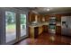 Bright and spacious kitchen with stainless steel appliances and access to the backyard at 1696 Hunting Creek Dr Se, Conyers, GA 30013