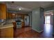 Spacious kitchen with stainless steel appliances, wood cabinets, and hardwood flooring at 1696 Hunting Creek Dr Se, Conyers, GA 30013