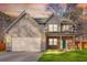 Charming two-story home featuring a gray exterior, two-car garage, well-kept lawn, and welcoming covered front porch at 4806 Forest Trl, Douglasville, GA 30135