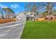 Charming two-story home featuring a gray exterior, two-car garage, well-kept lawn, and welcoming covered front porch at 4806 Forest Trl, Douglasville, GA 30135