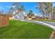 Charming two-story home featuring a gray exterior, two-car garage, well-kept lawn, and welcoming covered front porch at 4806 Forest Trl, Douglasville, GA 30135