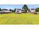 Large grassy backyard with a small pool and fenced perimeter, great for outdoor activities at 4905 Martin Farms Dr, Powder Springs, GA 30127