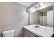 Bathroom featuring a vanity with modern fixtures, a shower-tub combo and updated lighting at 4905 Martin Farms Dr, Powder Springs, GA 30127