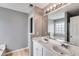 Bright bathroom showcasing double sinks, large mirrors, a soaking tub and updated fixtures at 4905 Martin Farms Dr, Powder Springs, GA 30127