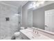 Updated bathroom featuring a tiled shower, vanity with modern fixtures, and updated lighting at 4905 Martin Farms Dr, Powder Springs, GA 30127