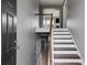 Inviting foyer with hardwood stairs and neutral gray walls, offering a glimpse into the home's interior at 4905 Martin Farms Dr, Powder Springs, GA 30127